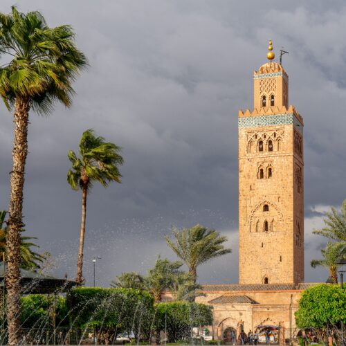 A beautiful shot of the Kutubiyya Mosque or Koutoubia Mosque on a cloudy day in Marrakesh, Morocco